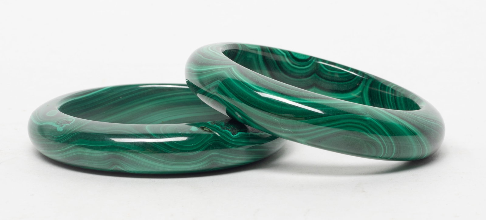 Two Chinese Vintage Malachite Bangles: Two Chinese malachite bangles. Approx. 2.7 inch outer diameter, 2 inch inner diameter (larger).