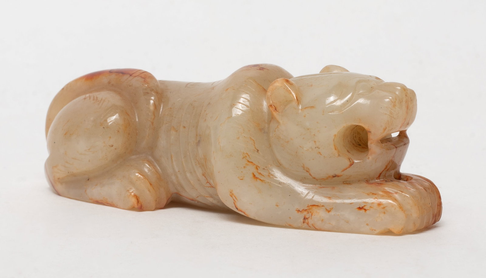 Chinese Russet Jade Paper Weight: Chinese russet jade paper weight carved in form of recumbent beast. Approx. 3.8*1.4*1.2 inch.