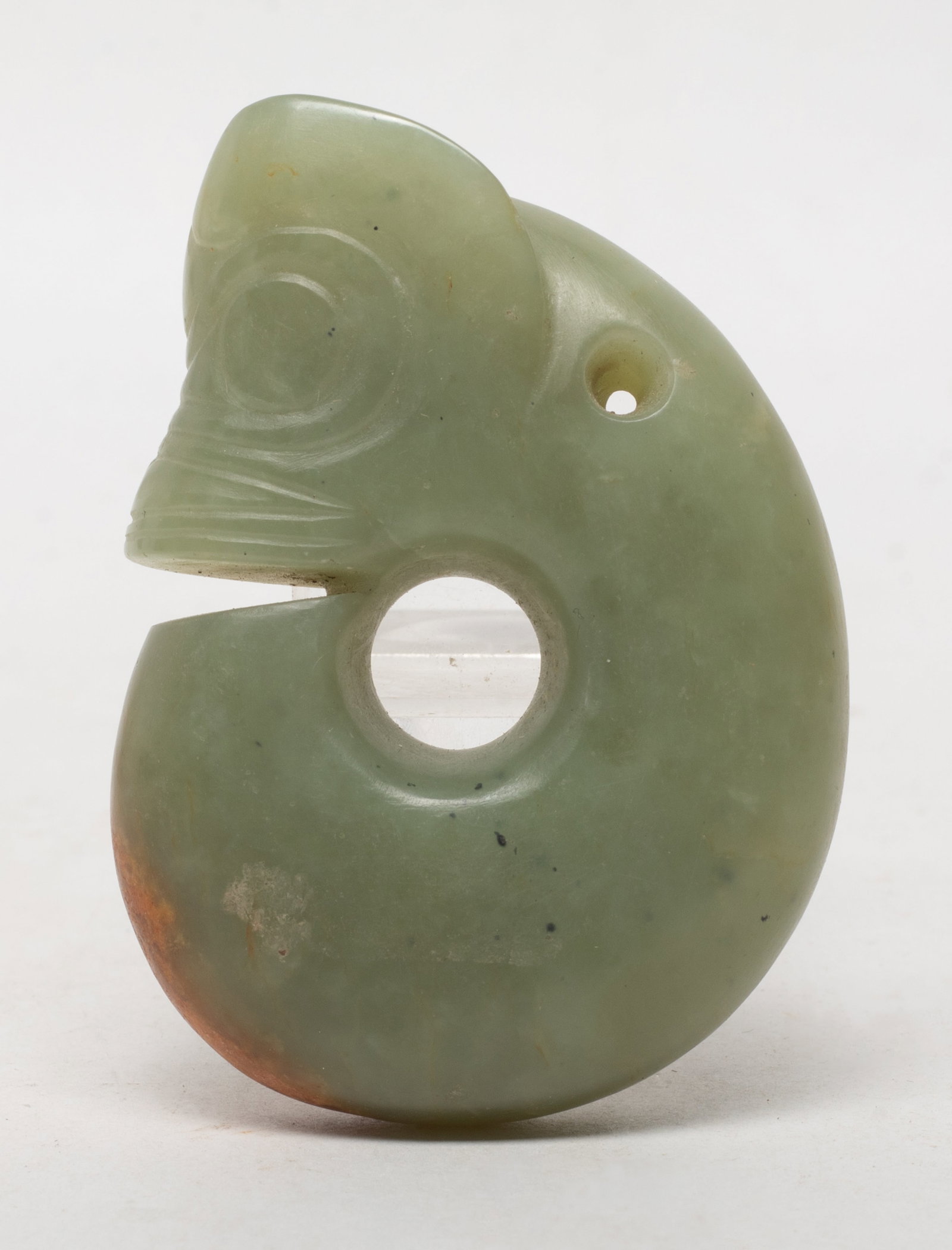 Estate Chinese Russet Jade Pendant: Chinese celadon and russet jade pendant carved of archaistic pig-dragon form. Approx. 2.5*1.9*0.7 inch.