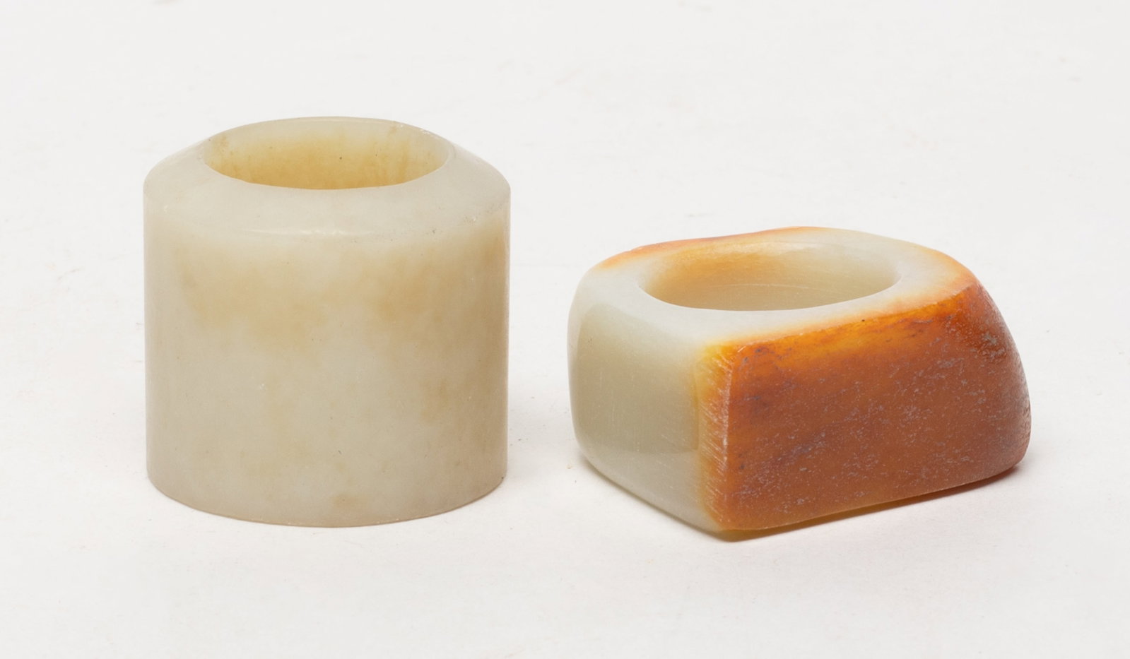 Estate Chinese Jade / Stone Thumb Rings: Two Chinese jade / stone thumb rings. Approx. 1.32*1.2 inch (larger).