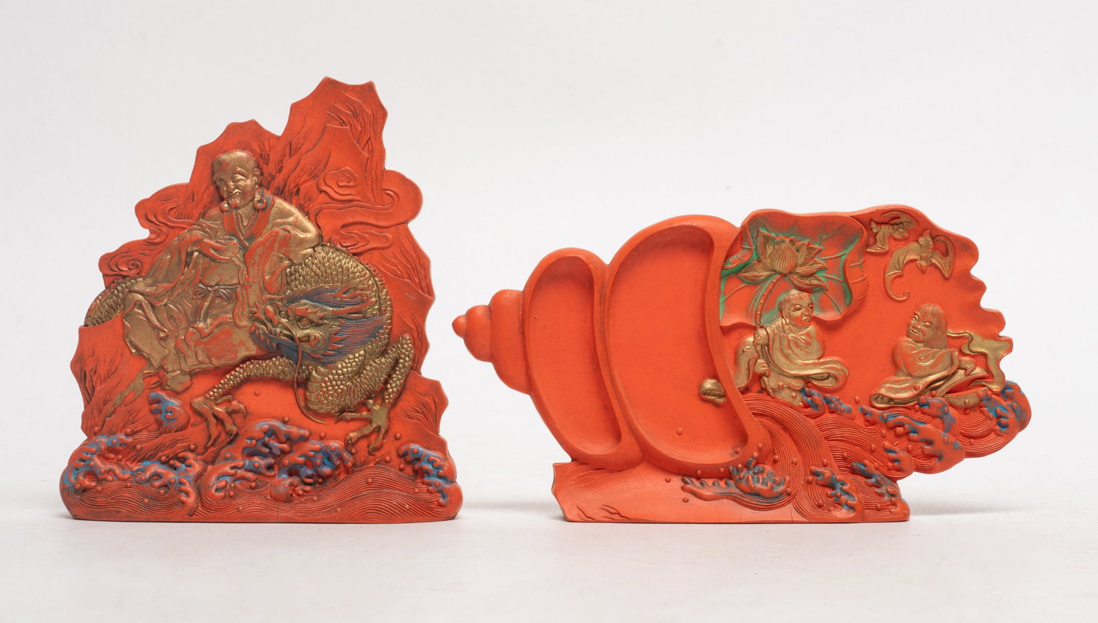 Two Chinese Red Ink Made Ink Sticks: Two Chinese red ink sticks, one carved with Hehe Erxian, the other carved Luohan and dragon. Approx. 6*3.25*1 inch (larger).