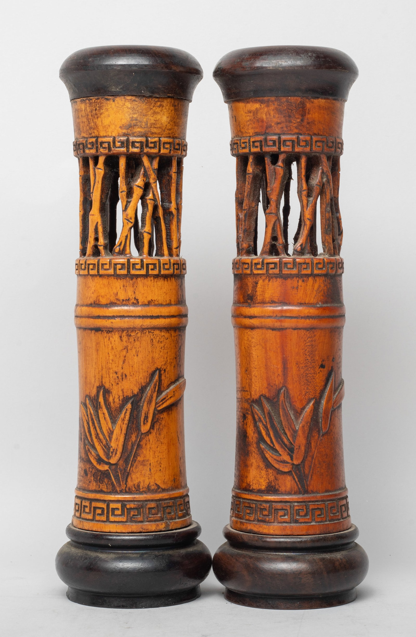 Two Chinese Wood Incense Pots: Two Chinese wood incense stick pots, reticulated with bamboo on the upper body and carved with bamboo leaves on the lower body. Approx. 10*2.6 inch.