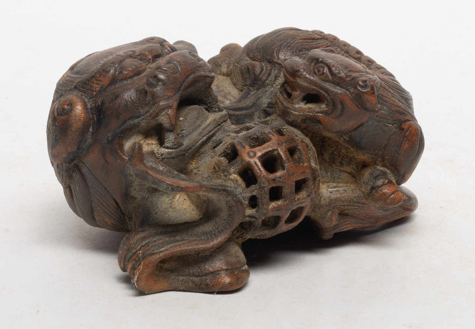 Estate Chinese Wood Beast: Chinese wood sculpture carved as a beast and its cub playing a ball. Approx. 4.8*3.9*2.4 inch.