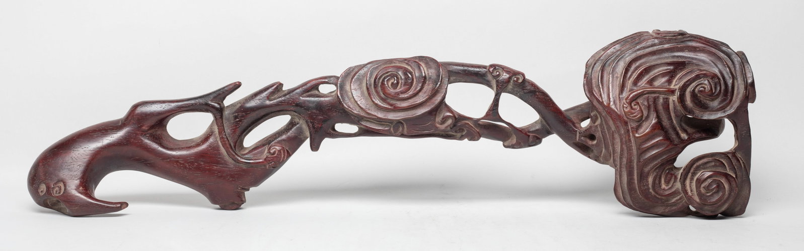Large Chinese Wood Sculpture of Ruyi: The scepter naturalistically worked in the form of a stem of lingzhi plant, the minor tributaries issuing from a thick gnarled branch, ending with clusters of auspicious fungus. Approx. 21.5*5.5*2.5