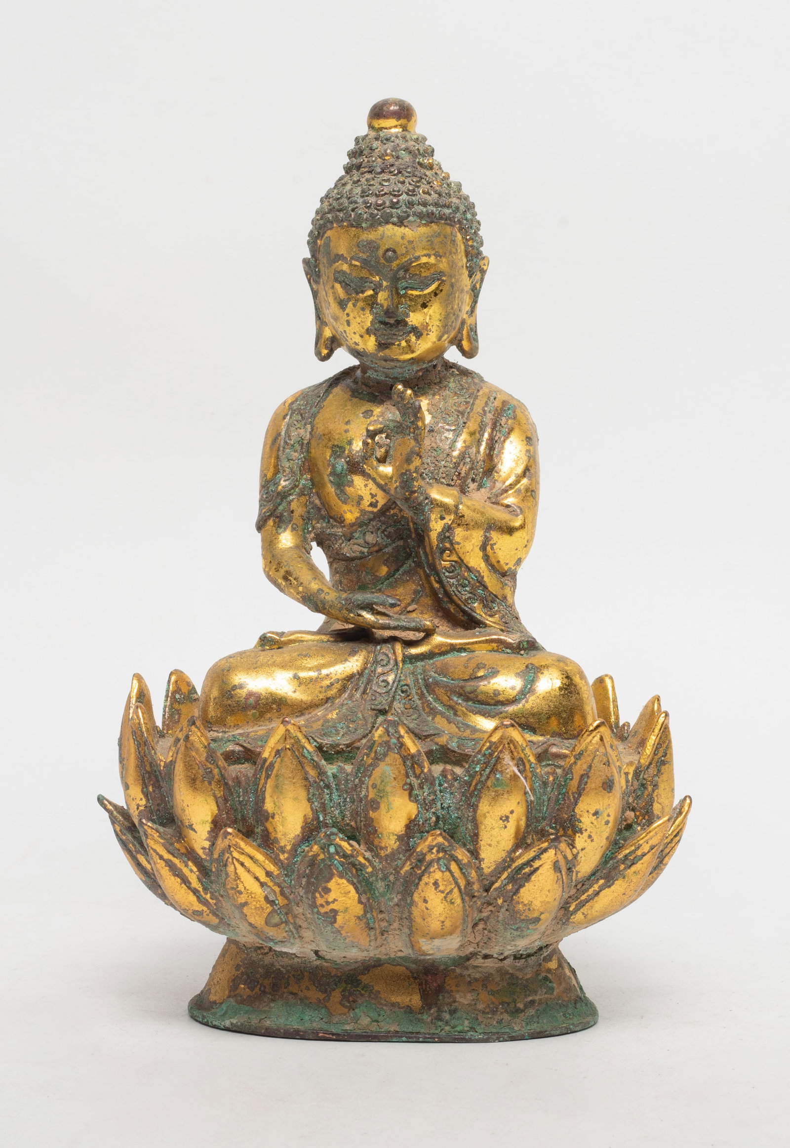 Chinese Gilt Bronze Sculpture of Buddha: Chinese gilt bronze sculpture of seated Buddha, the hands in elegant mudra. Approx. 8*5.2*4.2 inch.