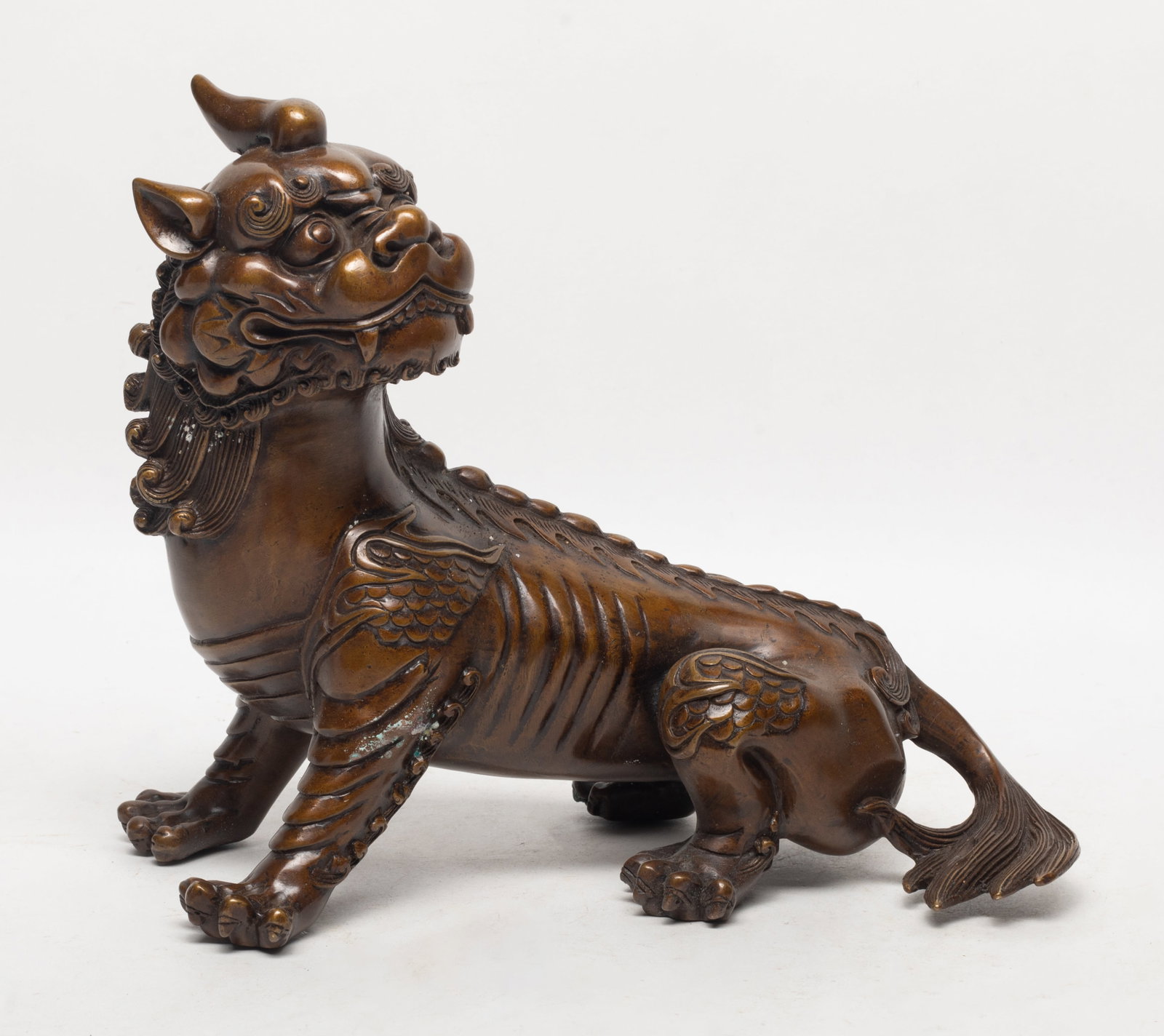 Chinese Export Bronze Beast Sculpture: Chinese bronze sculpture cast of mythical beast form. Approx. 7.5*8.8*4.5 inch.