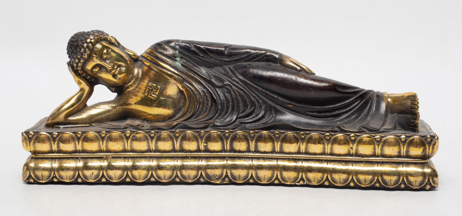 Chinese Brass Sculpture of Buddha: Chinese brass reclining Buddha sculpture. Approx. 7.5*2.3*2.8 inch.