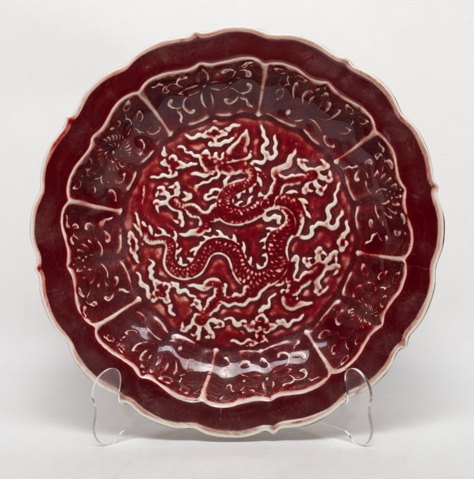 Unusual Chinese Red Glazed Porcelain Deep Plate: Chinese deep red glazed porcelain dragon plate. Approx. 10.8*2 inch.