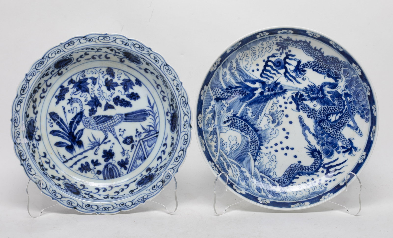Two Chinese Blue & White Porcelain Plates: Two Chinese blue and white porcelain plates, decorated with dragon or bird & flowers. Approx. 8.7 inch D (larger).