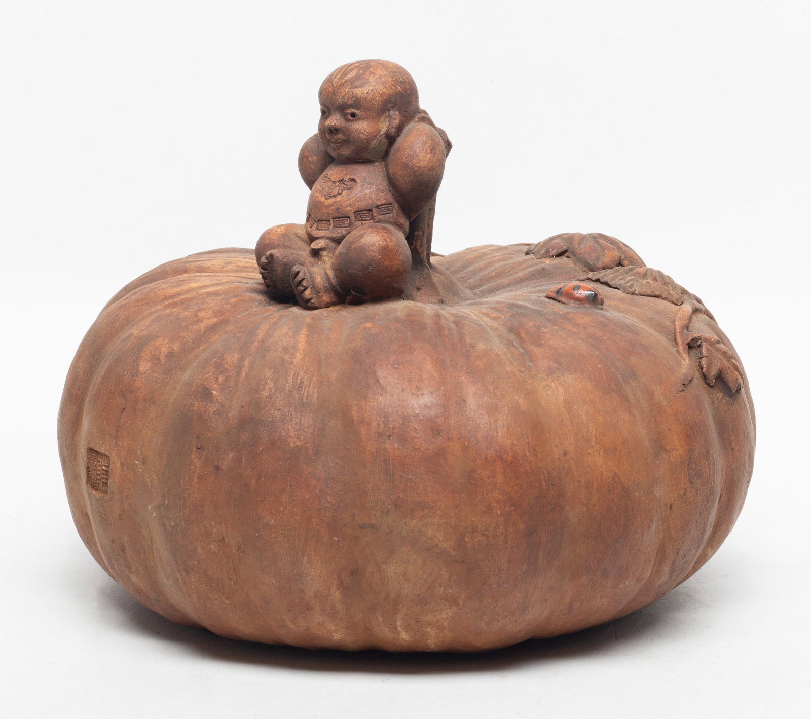Large Chinese Porcelain Sculpture: Large Chinese porcelain sculpture moulded as a boy sitting on a pumpkin. Approx. 8.2*6.2 inch.