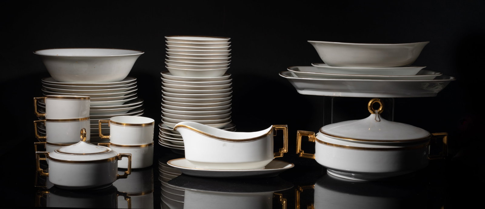 Set Old Heinrich & Co Selb Bavaria Porcelains: Set collectible gold color on cream porcelain service, marked Bavaria. Size varies.