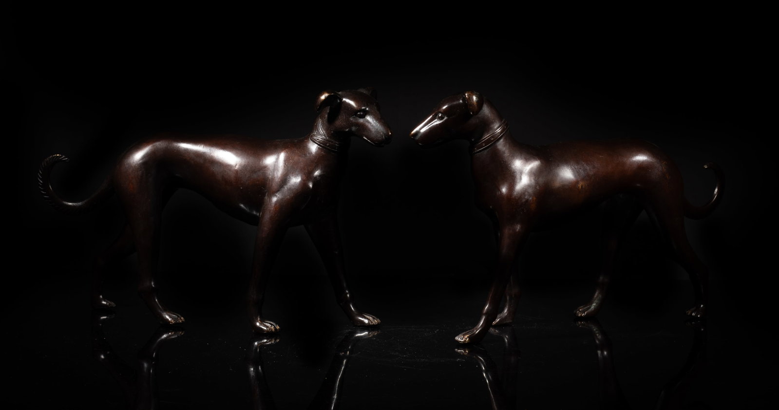 Two Vintage Bronze Sculptures of Dog: Two vintage bronze table sculptures of dog form. Approx. 12*7.5*2.5 inch (each). The Estate of S Pasadena, CA, 2005.