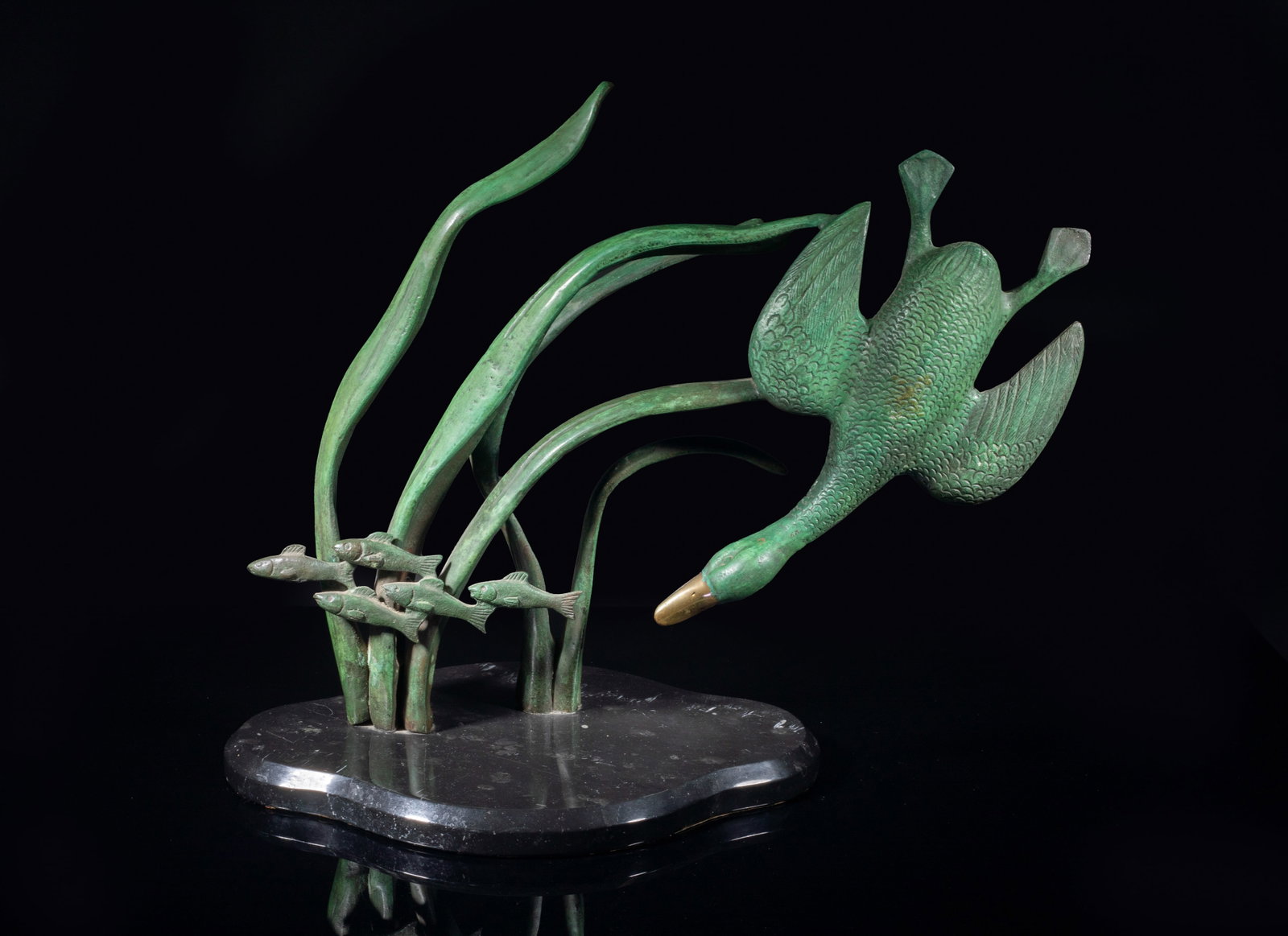 Large Vintage Painted Bronze Sculpture: Vividly cast as a duck chasing a group of fish among water plants. Approx. 18*15.2*9.1 inch.