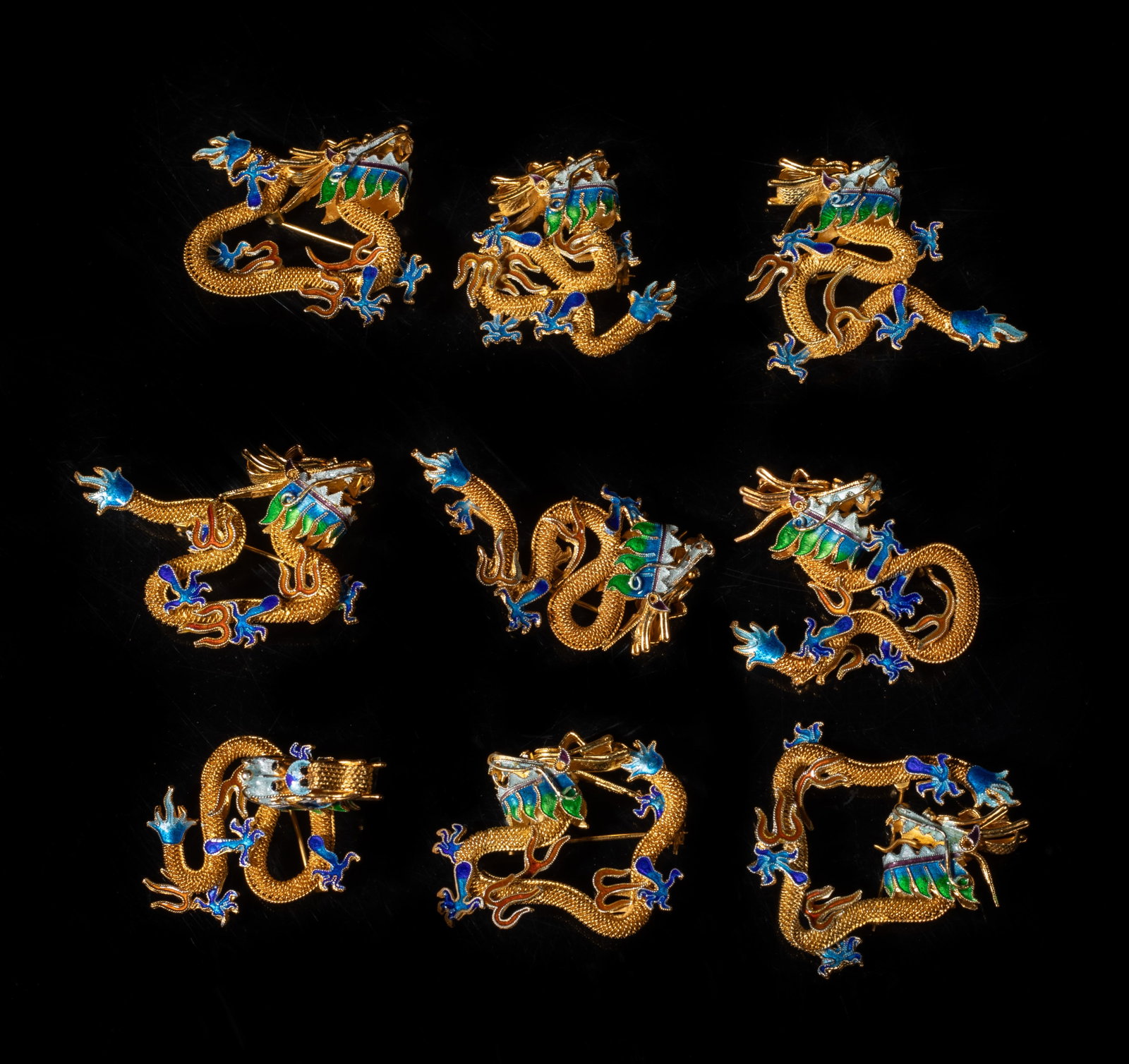 Vtg. Chinese Gold on Sterling Silver Brooches: Group of nine Chinese gold on sterling silver dragon brooches. Approx. 1.51*0.92 inch (each); 82g (total)