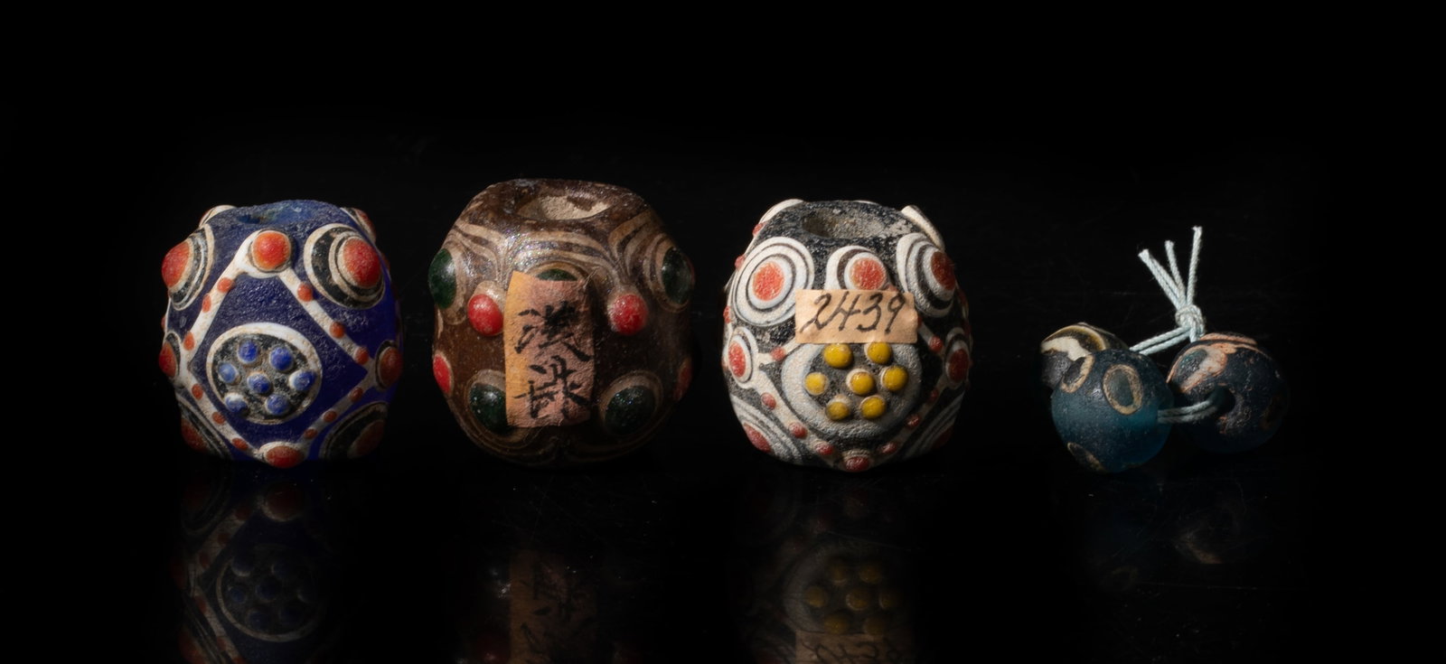 Set Chinese Old Dragonfly Eye Glass Beads: Set of six Chinese six dragonfly eye glass beads. Approx. 1.2*1.3 inch (largest bead). The Estate of the Pi Sum Park. Newport Beach. 1995.