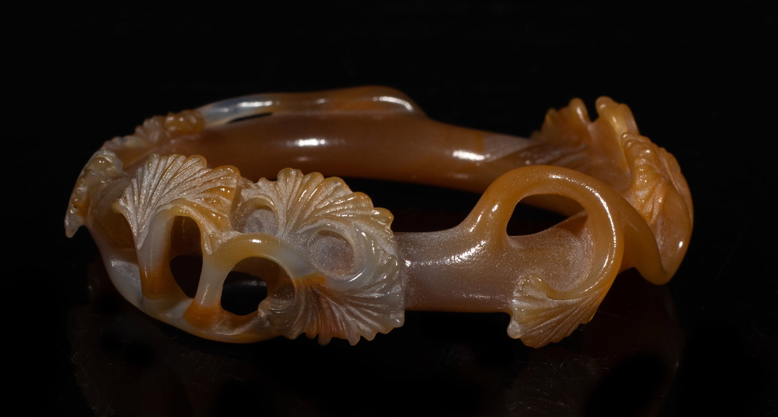 Rare Chinese Cameo Agate Carved Bangle: Chinese cameo agate bangle carved in high relief with ginkgo leaves. Approx. 3.1 inch outer diameter, 2.2 inch inner diameter. The Estate of the Consignment Stone Closed Sale. Palm Springs. 2022.