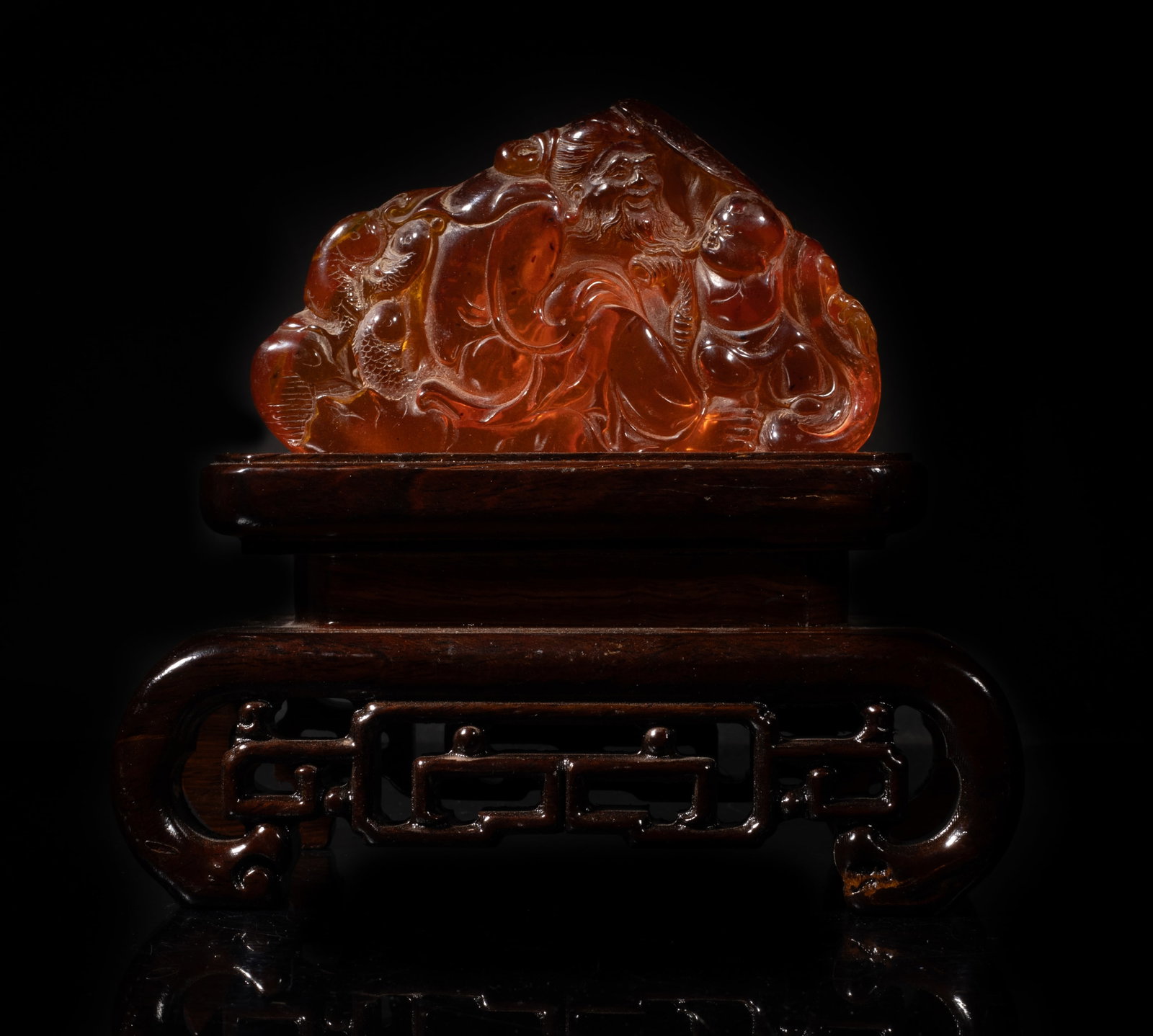 Vintage Chinese Export Amber Like Sculpture: Chinese amber-like sculpture carved with old fisherman and boy, affixed to wood stand. Approx. 7*6.3*4 inch (w/ stand).