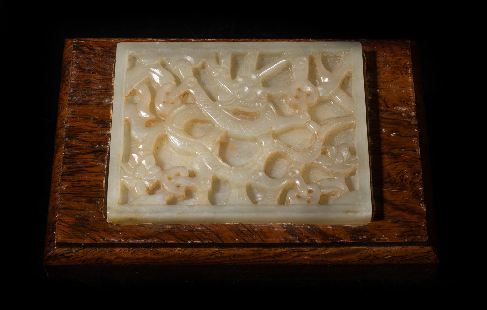Large Chinese Jade Dragon Plaque on Wood: Large Chinese jade plaque carved with dragon and flower, with wood base. Approx. 5.2*3.6*1.05 inch (w/ base).