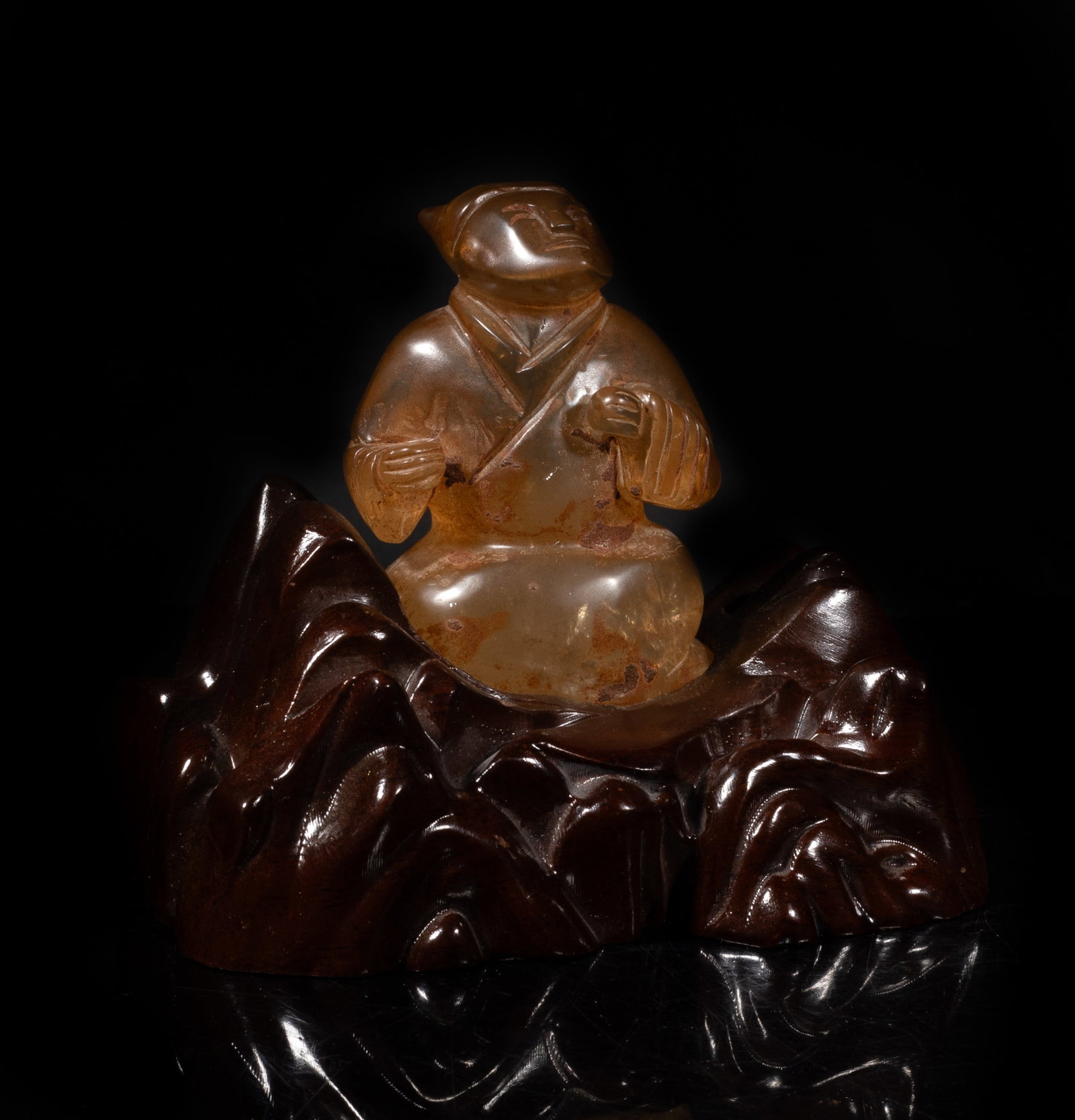 Chinese Rock Crystal Sculpture on Wood Base: Chinese rock crystal sculpture carved of figure form, affixed to wood base. Approx. 5.4*3.8*4.6 inch (w/ base). The Estate of the J. T. Chang. HK. 1992.