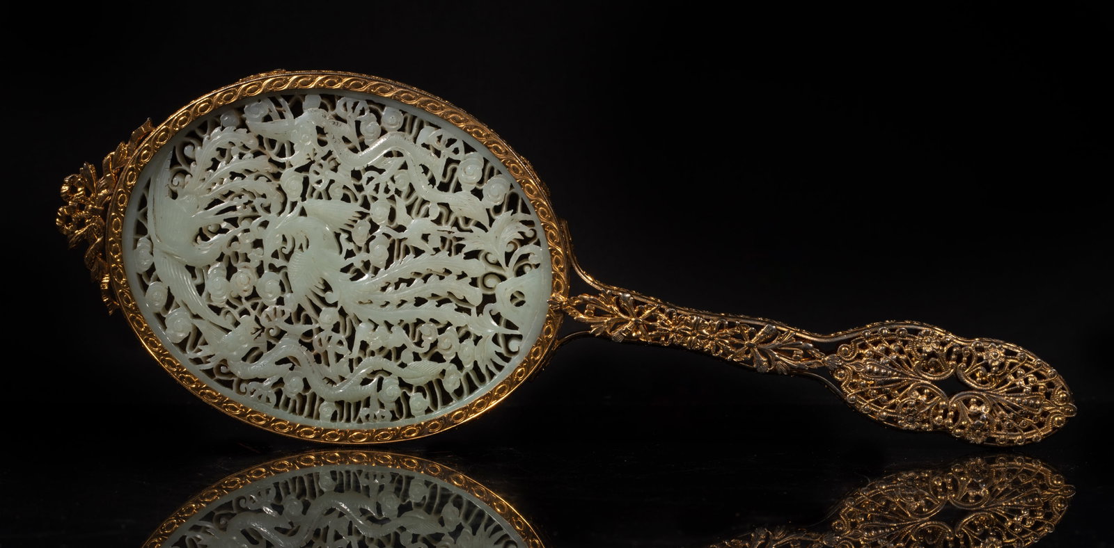 Unusual Chinese Export Mirror Inlaid Jade: The entire oval back of the mirror head insert with a large jade piece, carved in an openwork with dragon, phoenix and scrolls pattern, the long handle features highly openwork piercing with symmetric