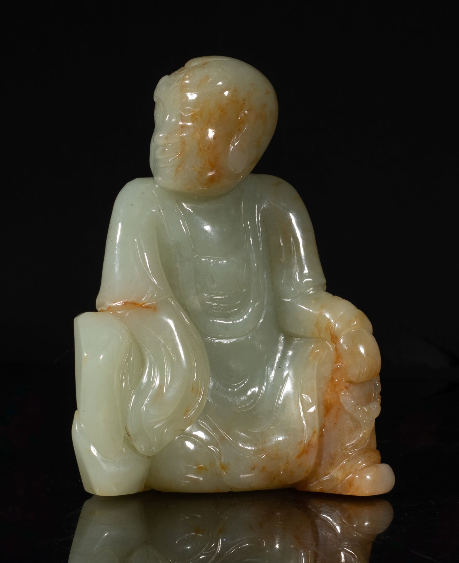 Chinese Russet Jade Sculpture of Luohan: Chinese russet jade seated Luohan sculpture, his head turned to right. Approx. 4.5*3.4*2.1 inch. The Estate of the Judy Ann. Palm Springs. CA. 2001.
