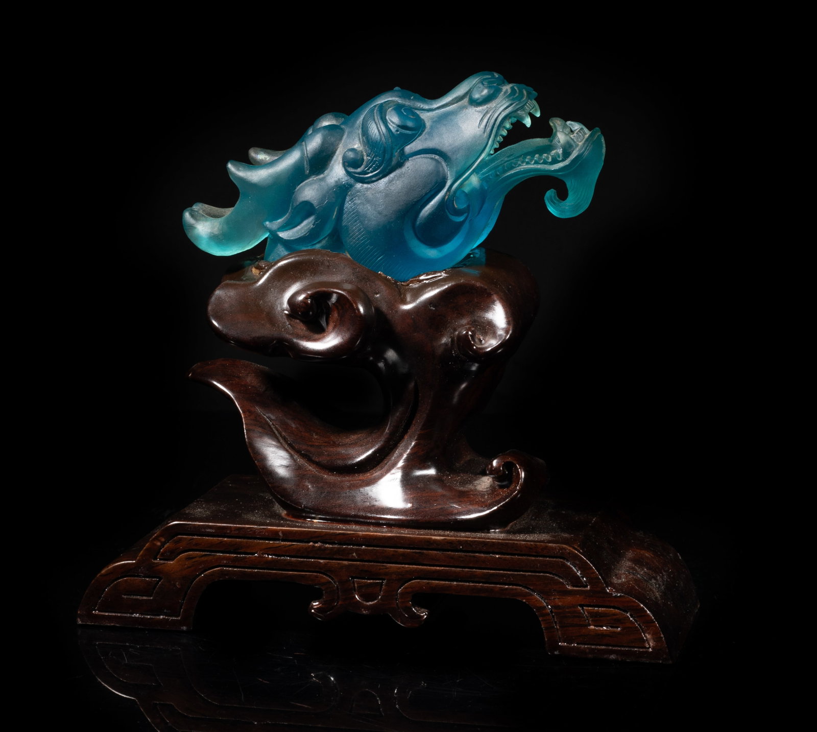 Chinese Blue Glass Dragon Head Sculpture: Large Chinese blue glass dragon head sculpture, with tall wood stand. Approx. 4.3*1.8*1.6 inch (glass size).