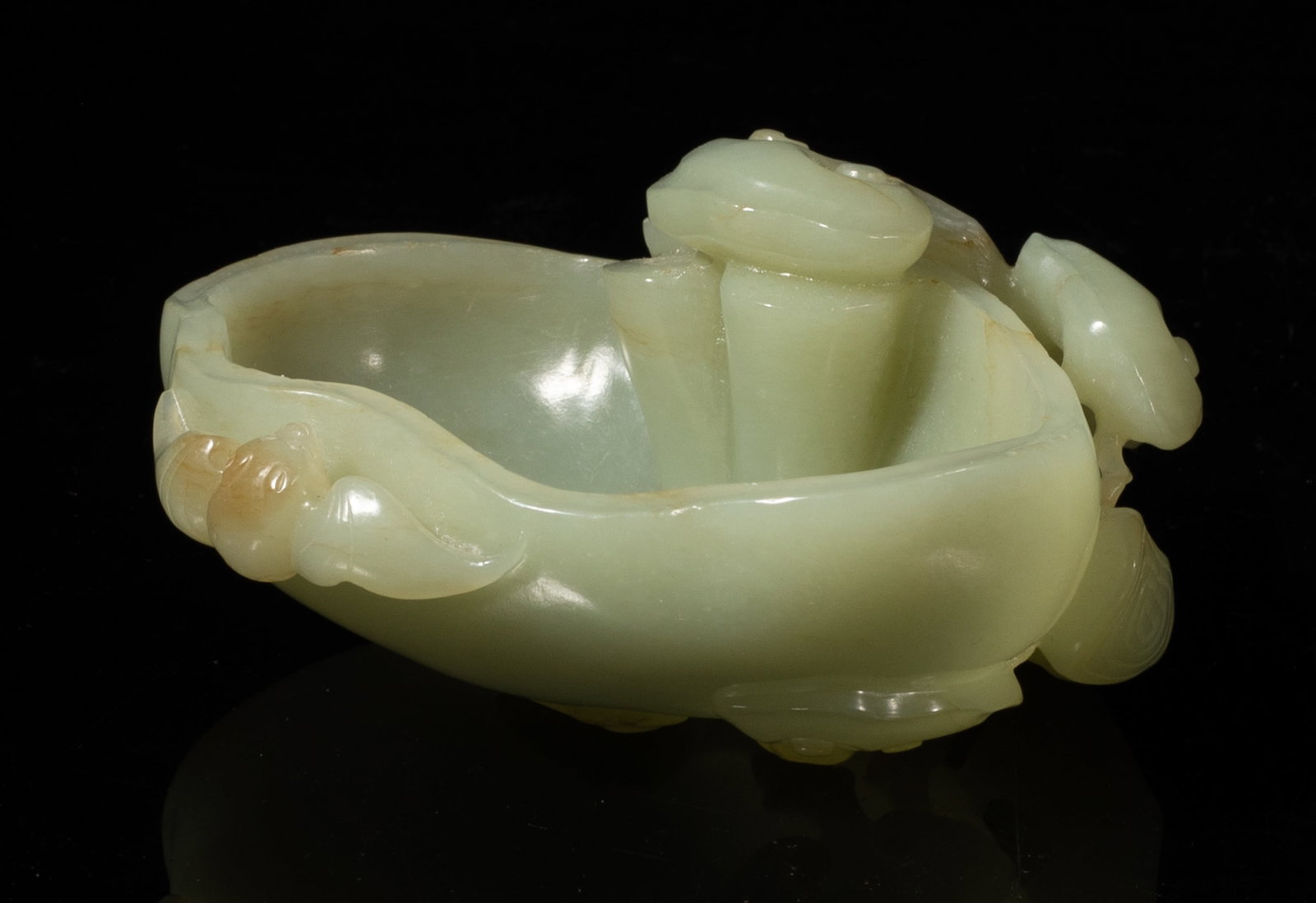 Chinese Linchi Form Jade Carved Washer: Chinese jade washer carved in high relief with linchi branch and bat. Approx. 3.9*3.5*1.9 inch. The Estate of the Judy Ann. Palm Springs. CA. 2001.