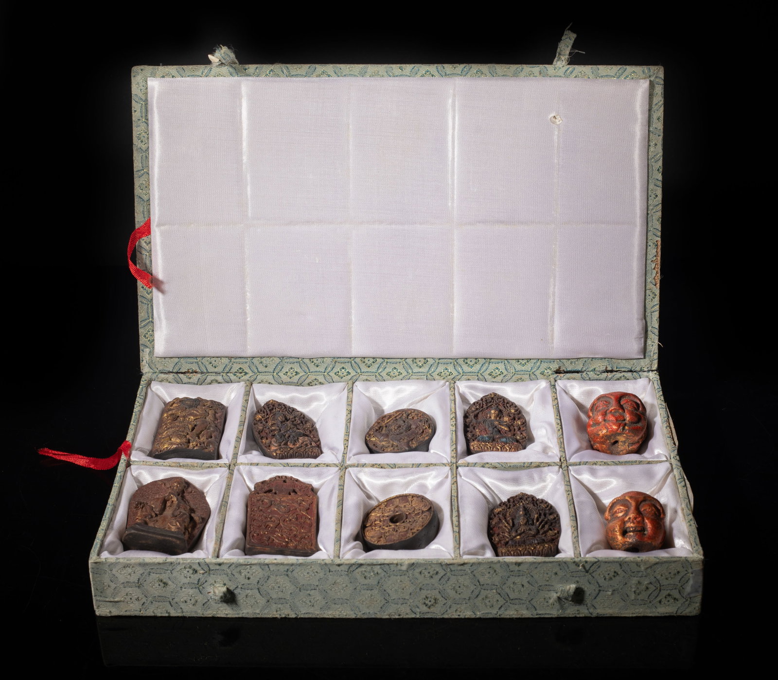 Large Set Chinese Mixed Agarwood Hexiang Pendants: Set of ten Chinese mixed agarwood hexiang pendants, slightly fragrant, with box. Approx. 250 gram (total weight), 2.4*1.6*0.7 inch (largest).