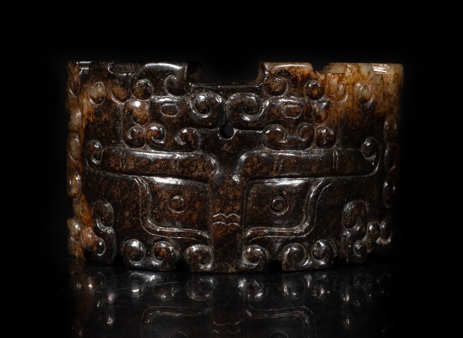 Rare Chinese Russet Jade Plaque: Chinese russet jade plaque of archaic style carved piece, detailed with taotie motifs. Approx. 2.97*1.76 inch