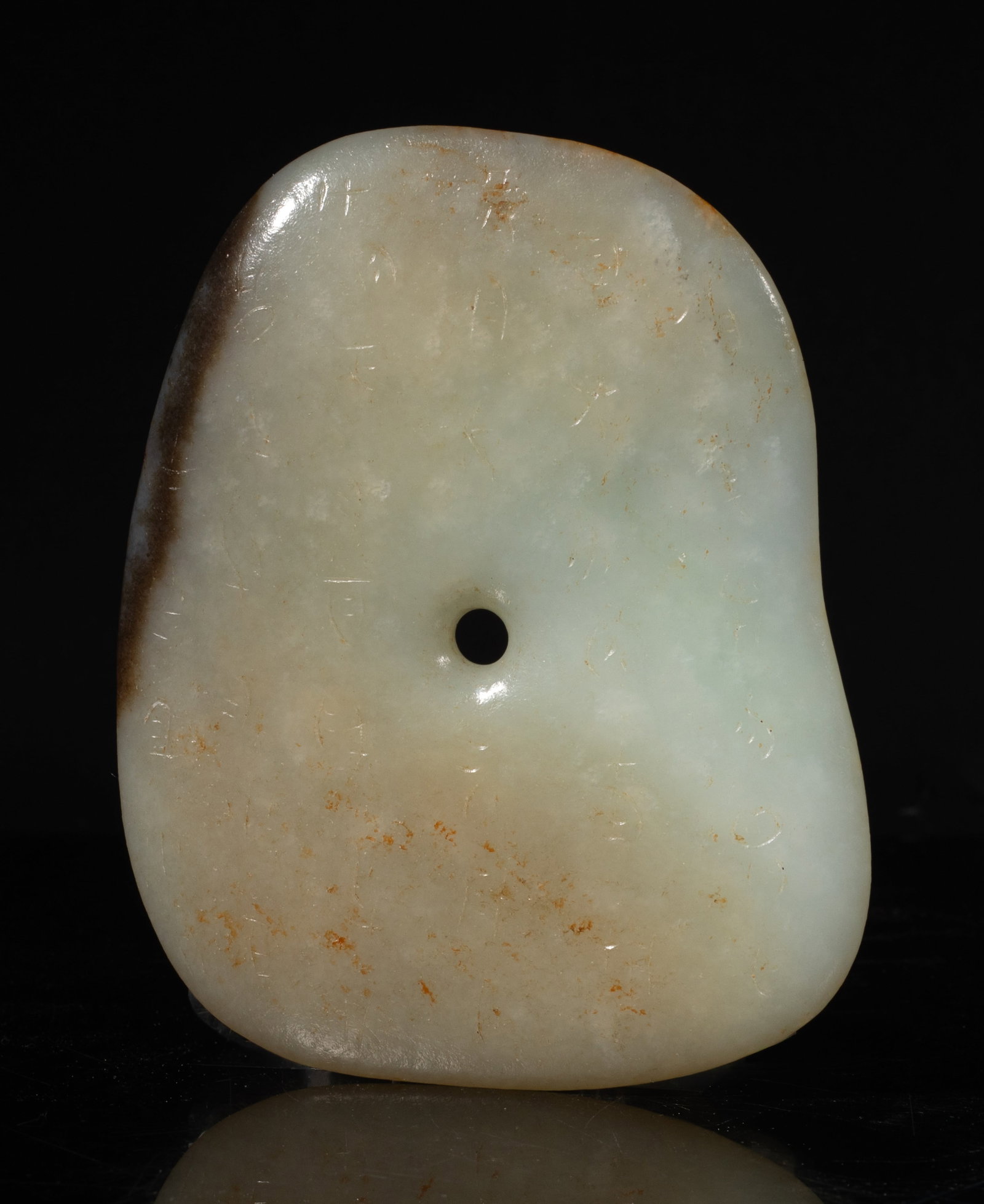 Chinese Early Style Jade Carved Bi: Chinese jade bi incised with ancient characters on both sides. Approx. 4.3*3.5 inch. The Estate of the Consignment Stone Closed Sale. Palm Springs. 2022.