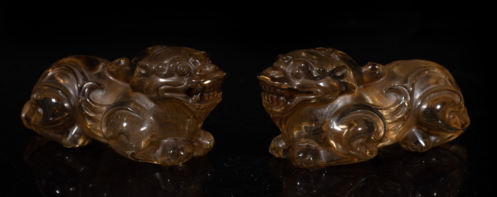 Two Chinese Rock Crystal Beast Sculptures: Two Chinese rock crystal carved recumbent beast sculptures. Approx. 2.95*1.35*1.35 inch (largest).