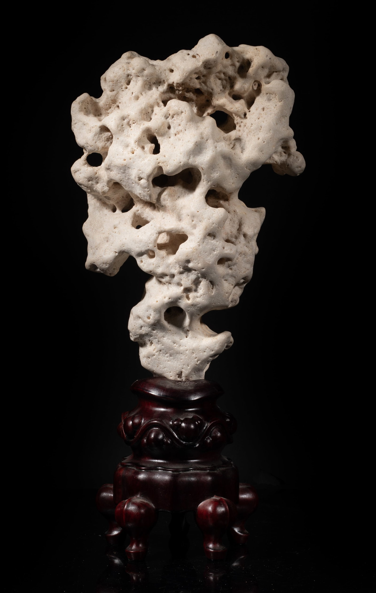 Chinese Taihu Scholar Stone w/ Wood Base: Chinese Taihu scholar stone sculpture with wood base. Approx. 15.5*7*4 inch (w/ stand). The Estate of S Pasadena, CA, 2005.