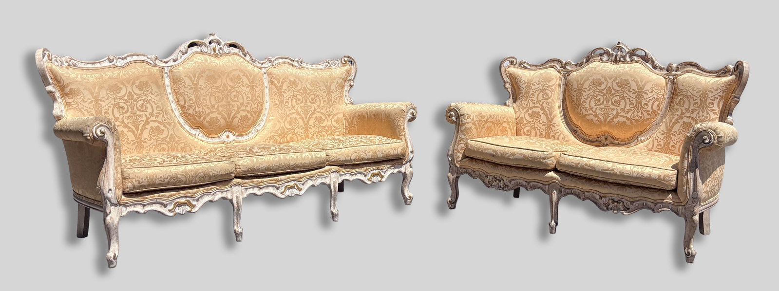 Sets Casa Padrino Baroque Sofa: Two Casa Padrino Baroque sofas, featuring an ornate, hand carved distressed frame and a luxurious gold floral pattern fabric. Approx. 77.25*41.25*29 inch