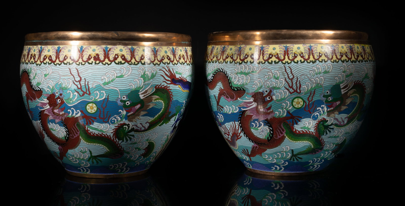 Two Large Chinese Cloisonne Dragon Pot: Each pot features dragons chasing flaming pearls amidst stylized waved and clouds, against the turquoise blue ground, finished with metal rims. Approx. 14.5*11.8 inch