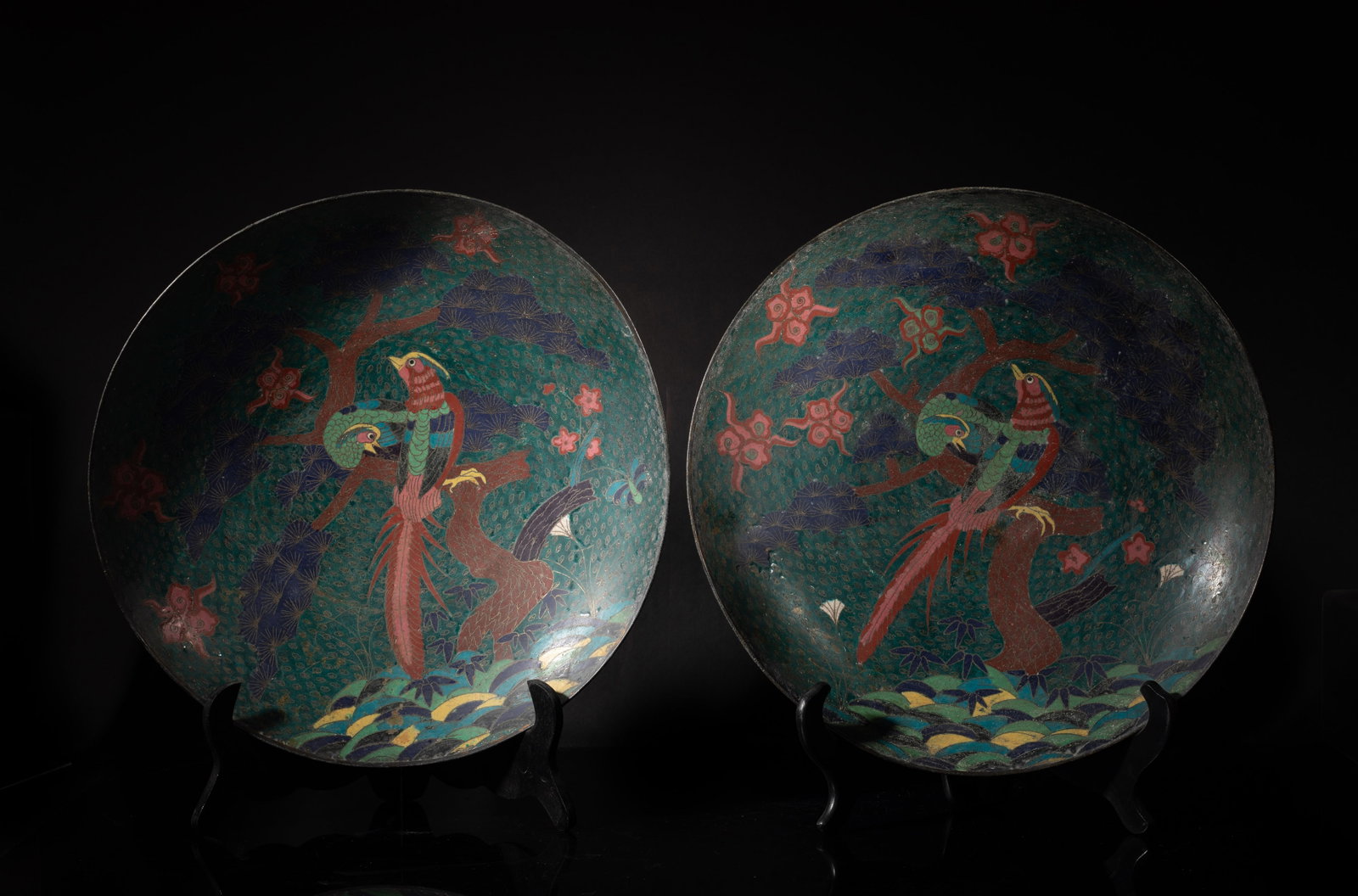 Two Japanese Edo Cloisonne Chargers: Each charger featuring a phoenix perched on a tree scene, both come with display case. Approx. 15.3*3 inch