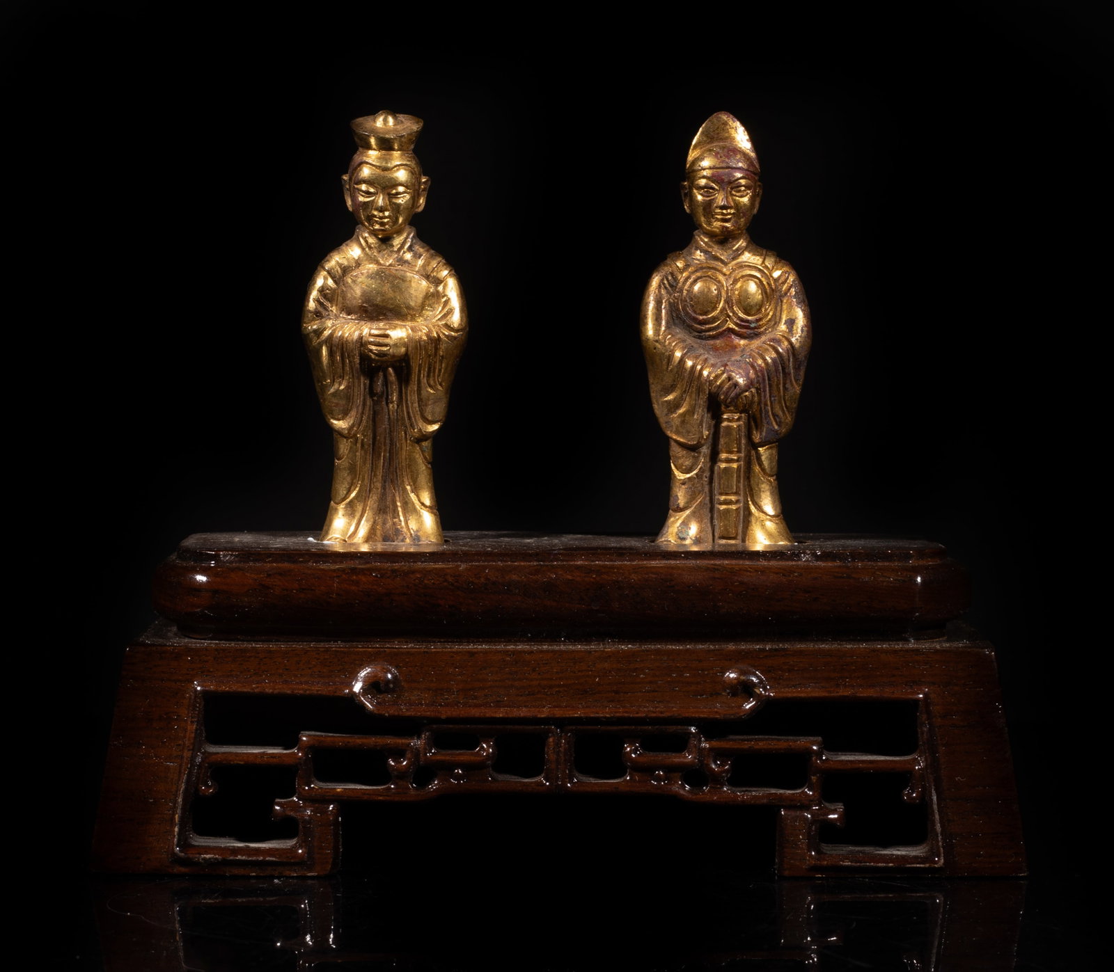 Two Chinese Gold on Bronze Figures: Two Chinese gold on bronze cast standing figure sculptures, affixed to wood stand. Approx. 7*5.7*3 inch (w/ stand). The Estate of Johnston & Son. 1998.