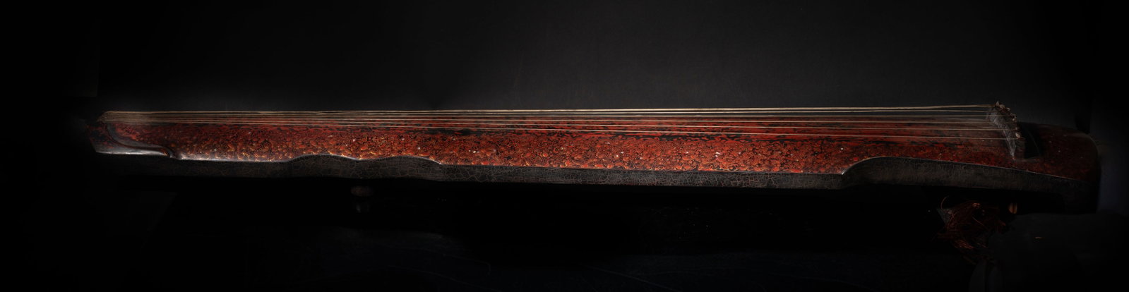Estate Chinese Lacquer Guqin: Estate Chinese lacquer guqin, the exterior painted with cranes amidst clouds motif, all against with the red-tone background. Approx. 48*7.8 inch.