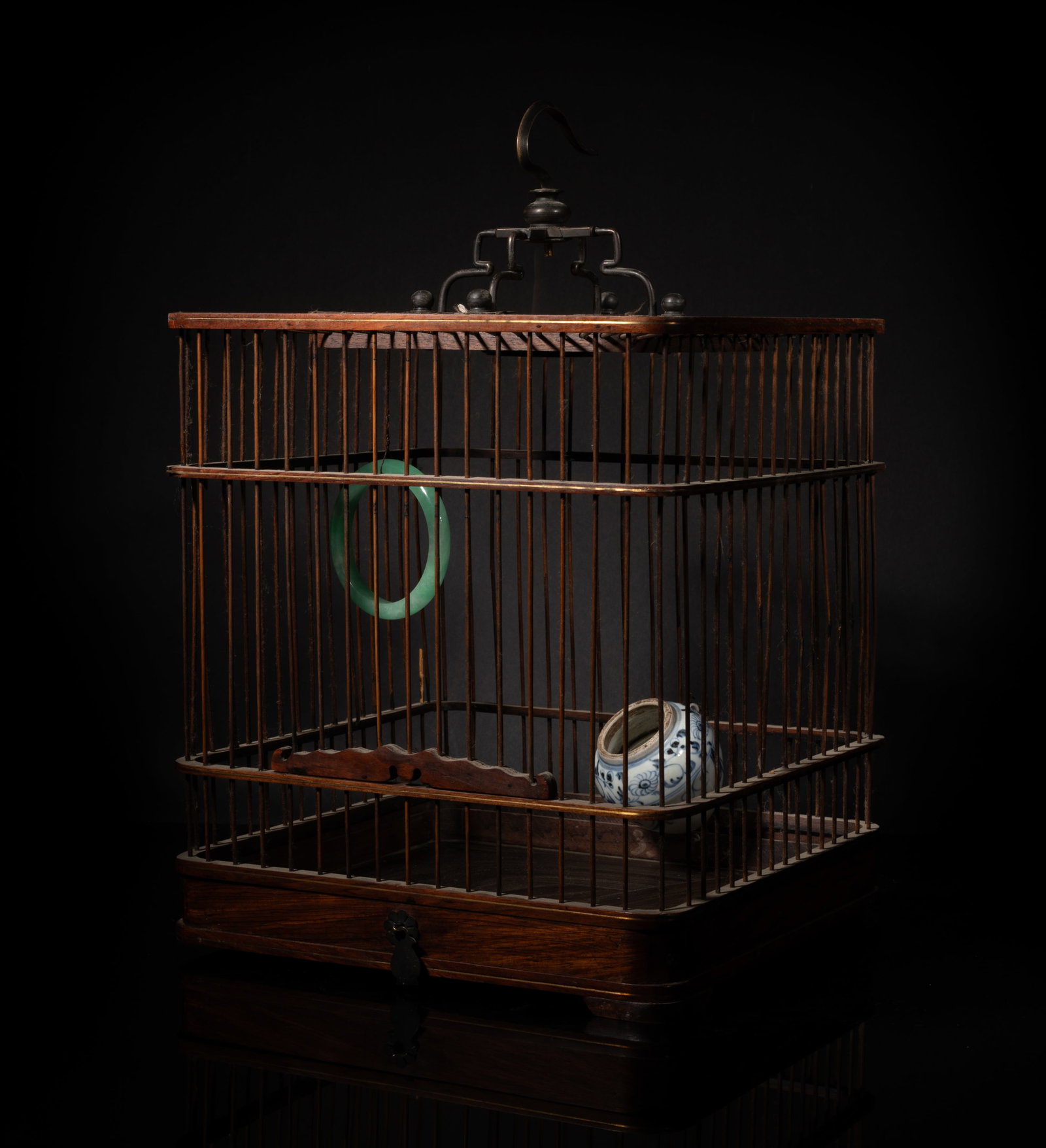 Chinese Export Huanghuali Wood Bird Cage: Chinese Huanghuali wood bird cage, with a blue and white porcelain feeding jar. Approx. 14*9*9 inch,
