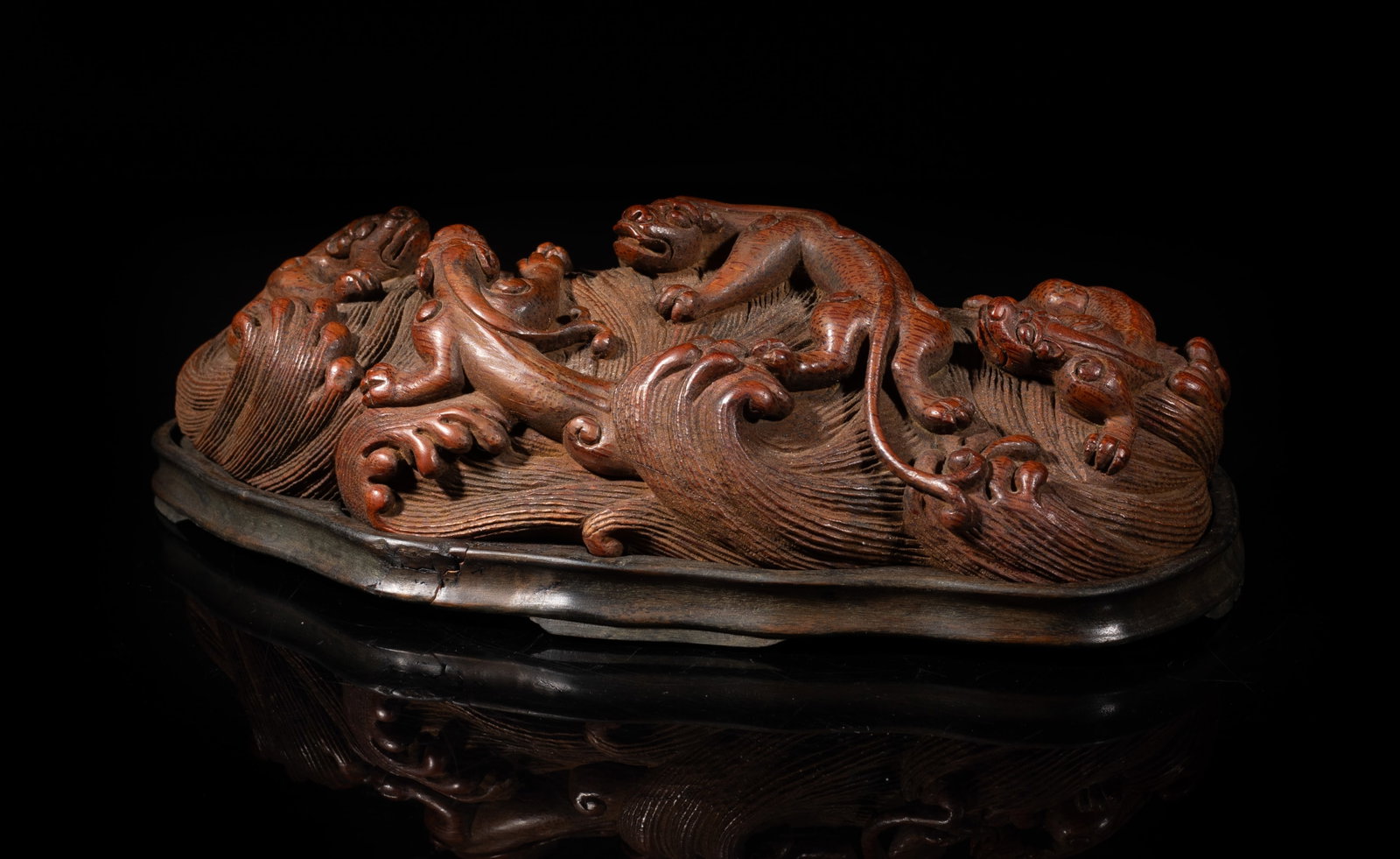 Antique Chinese Bamboo Table Sculpture: Chinese bamboo sculpture carved with beasts sinuous over waves, with wood base. Approx. 9.1*4.5*2.8 inch. The Estate of the Mark Oliver. Los Angeles. 1998.