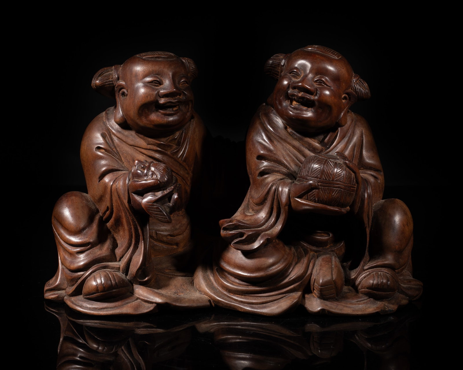 Antique 1900s Chinese Huanghuali Wood Sculpture: Antique Chinese Huanghuali wood sculpture carved as two boys holding toad and box. Approx. 1145 gram, 8.7*4.7*6 inch. The Estate of the Store Closed Sale, Downtown Los Angeles. 2020.