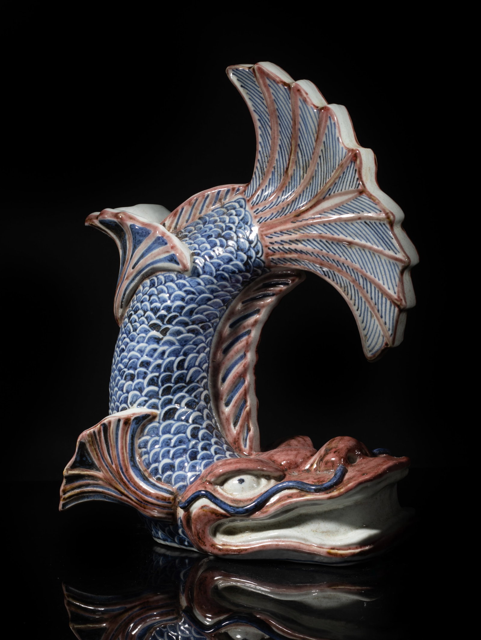 Estate Chinese Export Porcelain Dragon Fish: Chinese blue, white and copper red porcelain sculpture moulded of dragon-fish form. Approx. 12*9*5.3 inch. The Estate of the J & T Consignment, Closed Sale. Pal Springs, CA. 2019.