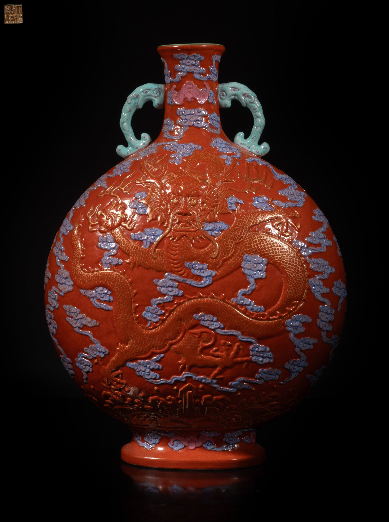 Chinese Famille Rose Porcelain Dragon Vase: Chinese famille rose porcelain vase carved with dragons and bats amongst clouds, with seal mark on the bottom. Approx. 11.8*8.5*4.5 inch.