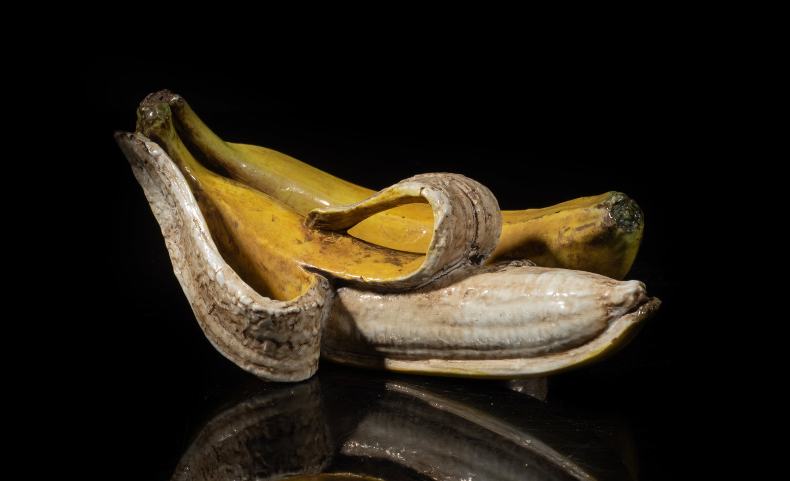 Chinese Export Porcelain Sculpture: Chinese banana form porcelain sculpture, incised with two marks. Approx. 5.4*3.4*2.5 inch. The Estate of the E Los Angeles, CA, 2022.