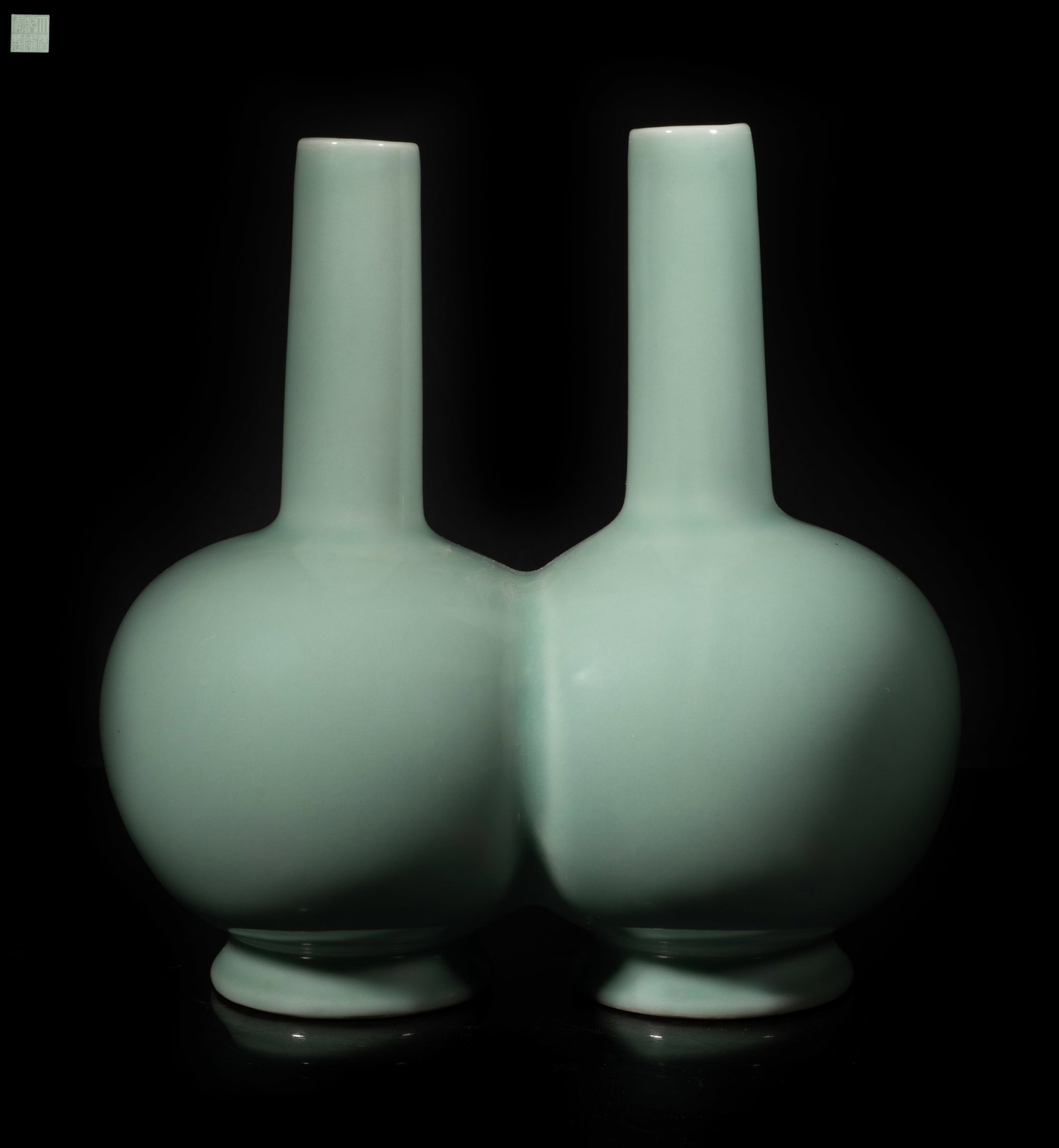 Chinese Bean Green Glazed Porcelain Vase: Chinese bean-green glazed porcelain vase of special twin vase form, each vase bottom with a seal mark. Approx. 8.8*8.8*5.2 inch. The Estate of the Jenny Park. Little Tokyo. Los Angeles. 1992.