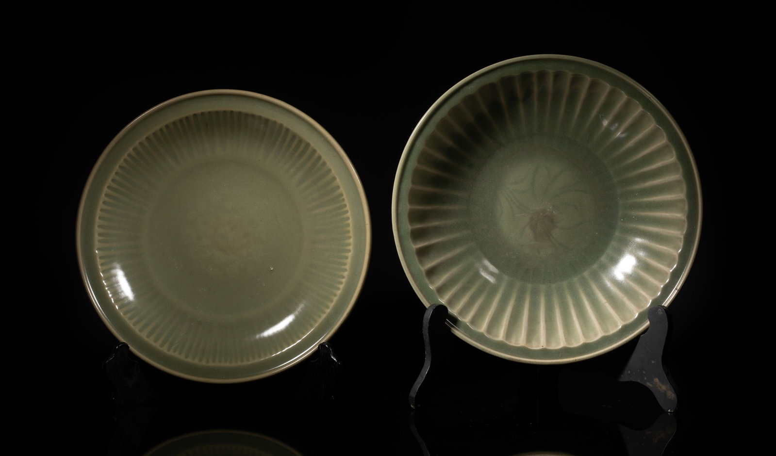 Two Large Chinese Longquan Porcelain Chargers: Two large Chinese Longquan type celadon glazed porcelain chargers, with stands. Approx. 13.6*3.4 inch (larger w/o stand). The Estate of the Store Closed Sale, Pasadena, CA. 2025.