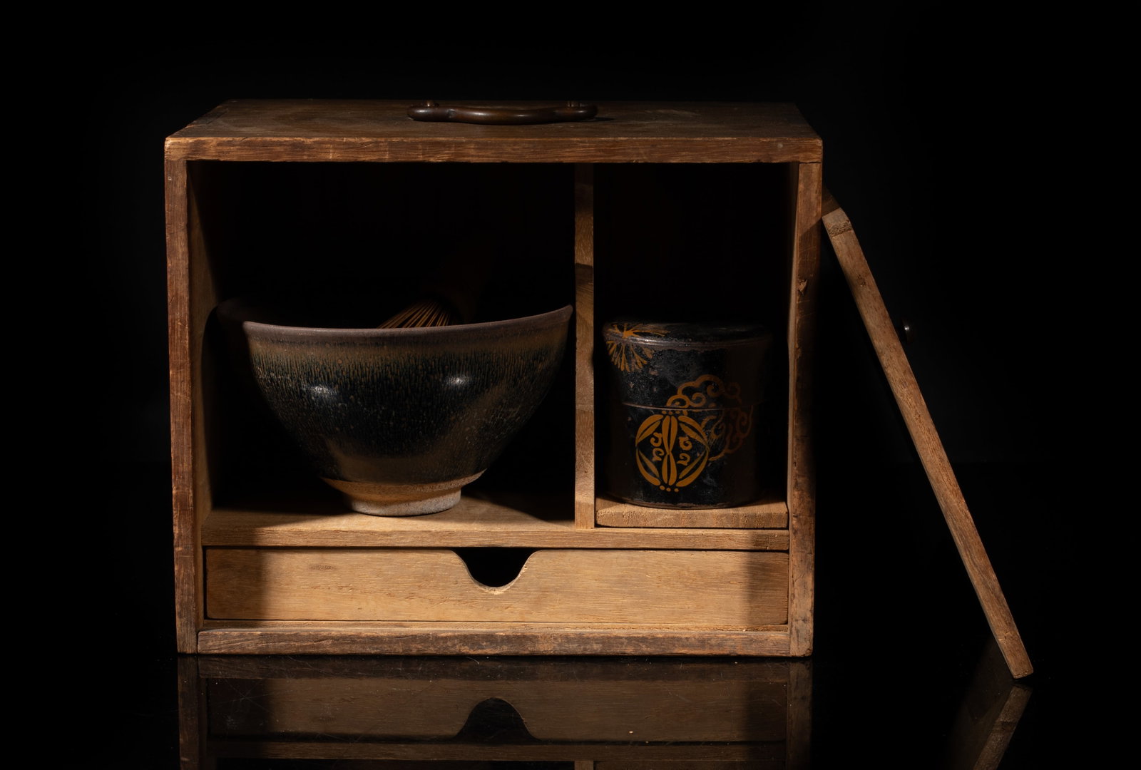 Estate Chinese Jian Ware Porcelain Tea Bowl: Including a metal tea jar, a porcelain tea bowl, a whisk brush, and a wood case. Approx. 4.9*2.8 inch (bowl size). The Estate of the Mark Oliver. Los Angeles. 1998.