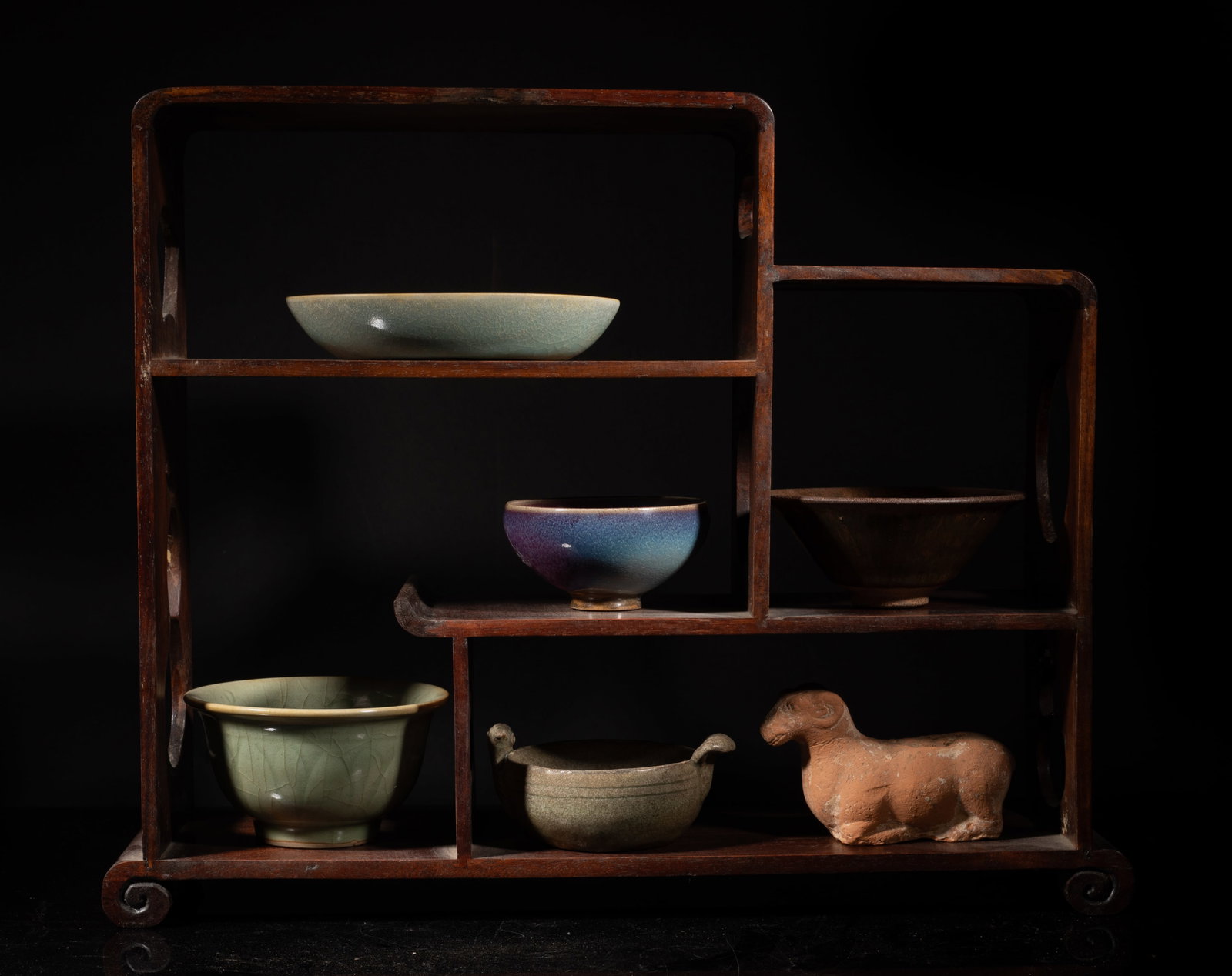 Set Chinese Export Wood Cabinet w/ Porcelain Wares: Including five Chinese glazed porcelain cups and a recumbent goat sculpture, with wood cabinet. Approx. 16.7*13.2*4.7 inch (cabinet size). The Estate of the Mark Oliver. Los Angeles. 1998.