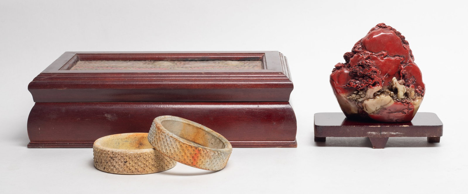 Chinese Decor Sculptures, Stone Bangles: Including a landscape form table sculpture with stand, and two stone bangles with box. Approx. 4.1*4*2.5 inch (sculpture size).