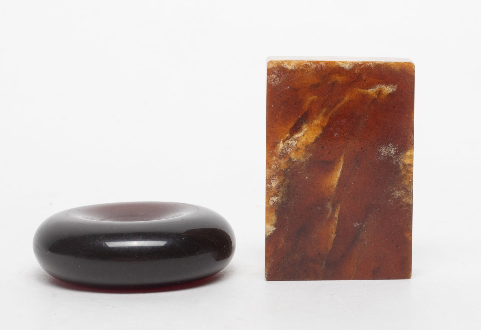Two Vintage Amber Pendants: Two amber carved pendants. Approx. 73 gram (total weight), 1.5*2.25*0.65 inch (larger).