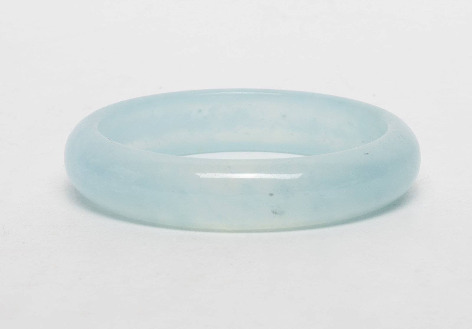 High Quality Aquamarine Bangle: High quality aquamarine carved bangle. Approx. 2.8 inch outer diameter, 2.25 inch inner diameter.